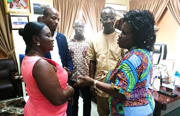 Ms Cecilia Abena Dapaah (right), Minister of Sanitation and Water Resources, interacting with Mr Roland Affail Monney (2nd right) , Mrs Linda Asante-Agyei (left) and some members of the GJA