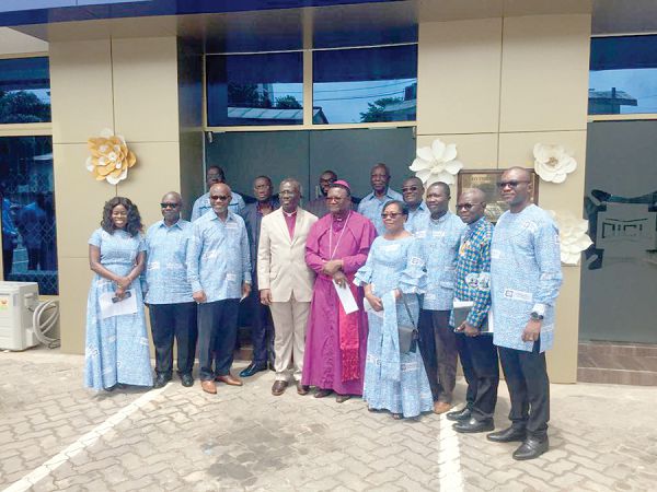 Board Members of Donewell with the clergy after the inauguration. inset: The refurbished head office building