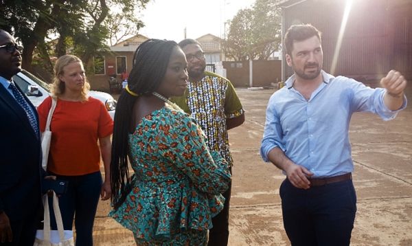 Mr Marc-Antoine Luraschi (right) explaining a point to Mrs Elizabeth Afoley Quaye (middle), Minister of Fisheries and Aquaculture, while others look on