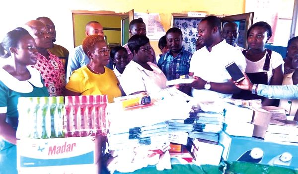 Members of the nuclear family of the late coach Afranie presenting some items to the Maternal and Child Unit of the Mankranso Hospital