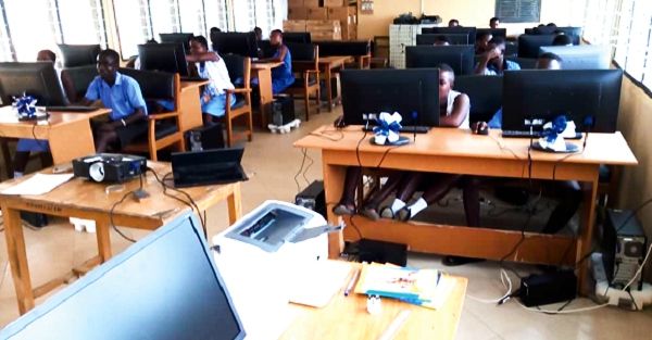 Students of the school trying their hands on the newly installed Hp desktop computers. 
