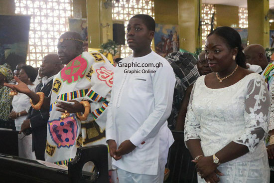 The Asantehene, Otumfuo Osei Tutu II (in Kente), opens his arms as he received blessings during his 69th Birthday Mass at the St Cyprian Anglican Cathedral in Kumasi. With him is wife, Lady Julia Osei Tutu, and son, Nana Kwame Kyeretwie. Pictures: EMMANUEL BAAH