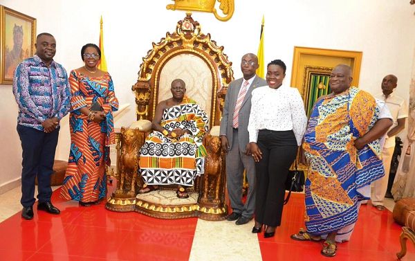 Otumfuo Osei Tutu II (seated) with officials of Dominion University college