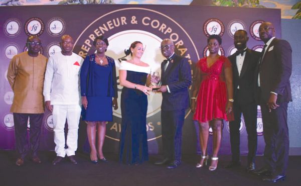   Mr Kwamena Bartels receiving his award from the French Ambassador in Ghana, Mrs Anne Sophie Ave