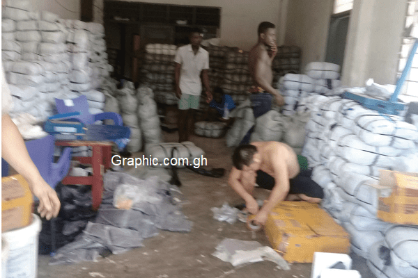 Some workers busy at the factory at the time of the raid