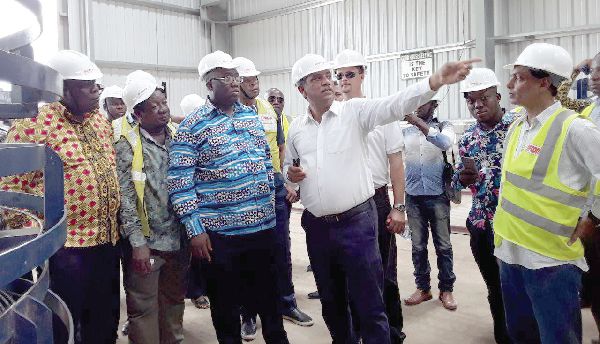  Mr Udai Veer Singh, the General Manager of Afcons Infrastructure Limited, the contractor on the project, explaining a point to the Minister of Railway Development,  Mr Joe Ghartey (3rd left)