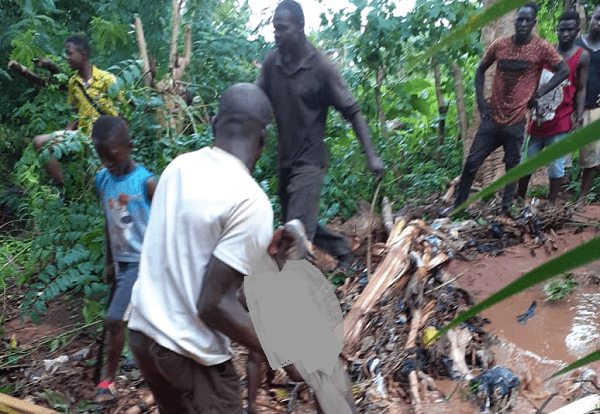 One of the children being taken out of the flood