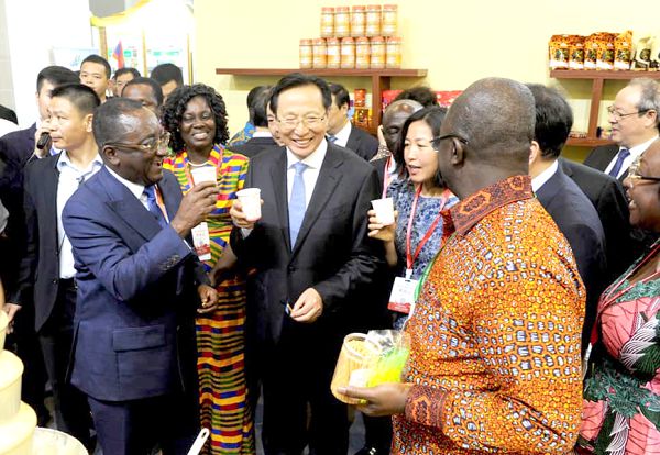 Dr Owusu Afriyie Akoto (left) together with some guests enjoying a cocoa drink at the Ghana’s stand at the third China International Tea Expo 2019 in Hangzhou in the Zhejiang Province, China
