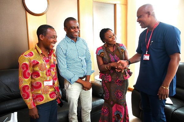 Mr Ato Afful (right) shaking hands with Dr Justina K. Ansah (2nd right). With them are Mr Stephen Addai-Baah (2nd left), Public Relations Officer, National Blood Bank, and Mr Emmanuel Arthur (left), Corporate Communications Manager, GCGL. Picture: SAMUEL TEI ADANO