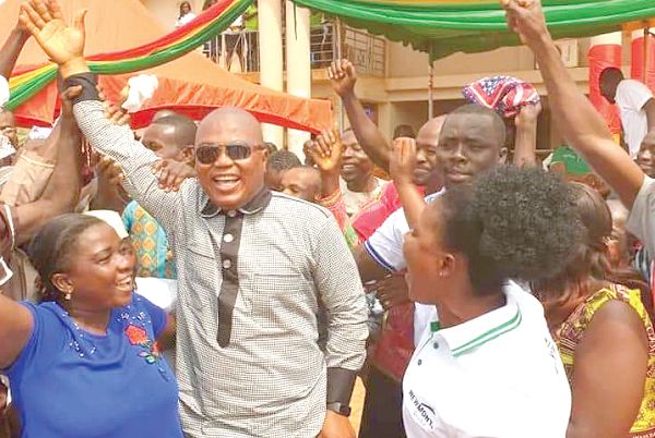 Mr Francis Osei (2nd left), the elected NPP Chairman of the Ahafo Region