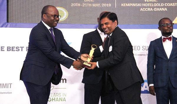 Dr Ernest Addison (left), Governor, Bank of Ghana, presenting the CEO of the Year Award (Agri Business) to Mr Amit Agrawal, CEO, Olam Ghana Limited in an awards ceremony that formed part of the summit. Picture: BENEDICT OBUOBI