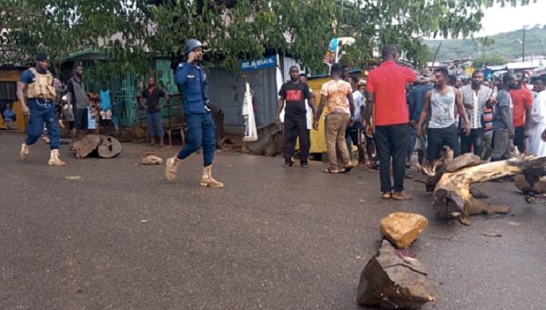 Police moving in as demonstrators block the main road
