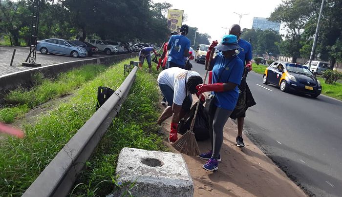 Some of the Rotary members cleaning the Ring Road street