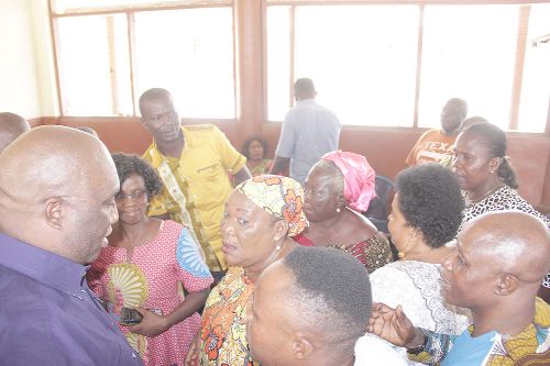 Mr Joe Ghartey (left) in an interaction with traders after the meeting. Picture: EDNA ADU-SERWAA