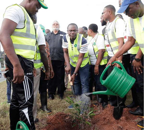 Flt. Lt. Rawlings with Mr Joseph Siaw Agyepong (with shovel) and others during the exercise in Accra