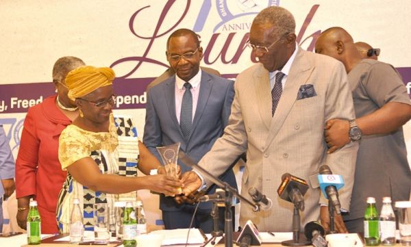 Ms Ajoa Yeboah Afari (left), board member, Graphic Communications Group Limited presenting a shield to Former President John Agyekum Kufuor for his contributions to media freedom at the ceremony. Picture: NII MARTEY M. BOTCHWAY