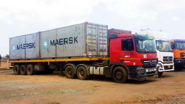The trucks with the containers carrying large quantities of rosewood lumber, in spite of the ban placed on the cutting and conveyance of the wood. Picture: Benjamin Xornam Glover