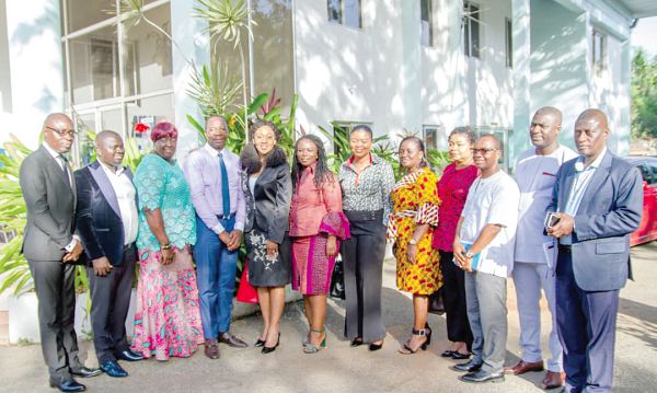 Mrs Jean Mensa (5th left) and other Commission members with GJA executives after the visit