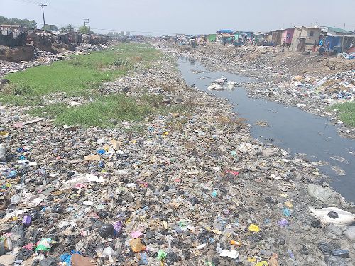 The Odaw drain at the Galloway side of Agbogbloshie is pregnant with waste of all kind.