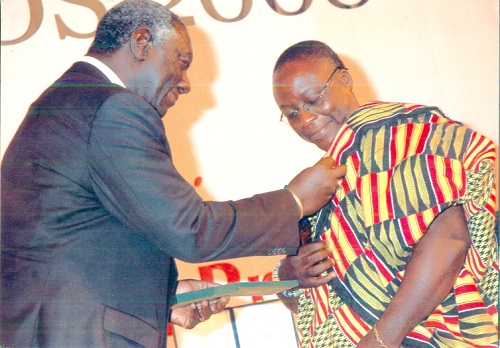 Mr Amankwa-Ampofo being decorated with the Grand Medal (media) by former President John Agyekum Kufour during the 2008 National Awards.
