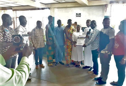 Mr Eric Adu Gyamfi (2nd right) presenting the items to Rev. Sister Parisundam Matangi, the Administrator of the hospital