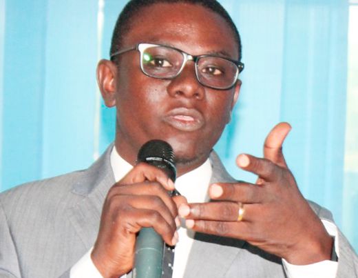 Mr Prosper Ahoetu (left), Executive Director, Youth Network for Human Rights and Democracy (You-net), addressing the participants
