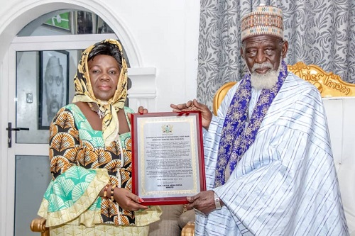 The Chief Imam receiving the citation from the sector minister Hon. Cecilia Abena Dapaah