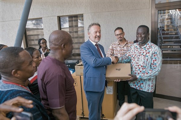  Mr Christoph Retzlaff (3rd left) presenting the items to Mr Ignatius Baffour Awuah 