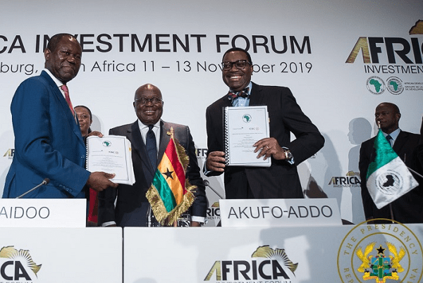 President Nana Addo Dankwa Akufo-Addo, flanked by Mr Joseph Boahen Aidoo (left) and Dr Akinwuni Adesina, after signing the agreement