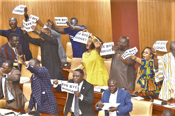 The Minority in Parliament displaying their ‘bye bye’ placards after the budget statement had been read.