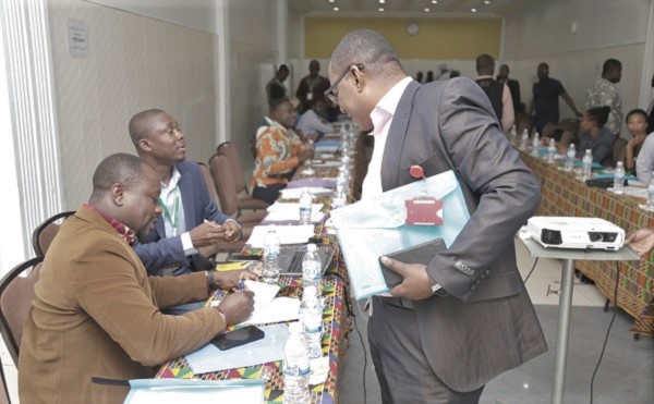  Mr Kobby Asmah (right), Editor, Daily Graphic, interacting with Mr Robert Sogbadji (left), Deputy Director, Renewable and Alternative Energy, Ministry of Energy, and Mr Collins Osae, Monitoring and Evaluation Specialist, ECREEE after the workshop