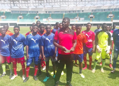 Coach Samuel Boadu with some players