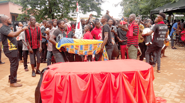 The coffin bearing the remains of the unknown African slave from Barbados as it was brought to the burial site
