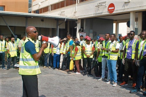 Mr Charles Honson Adjei (left), Group Executive, Airport Management, of the Ghana Airport Company, briefing some staff of the company at the “foreign objects and debris walk” organised at the Kotoka International Airport in Accra. Picture: GABRIEL AHIABOR