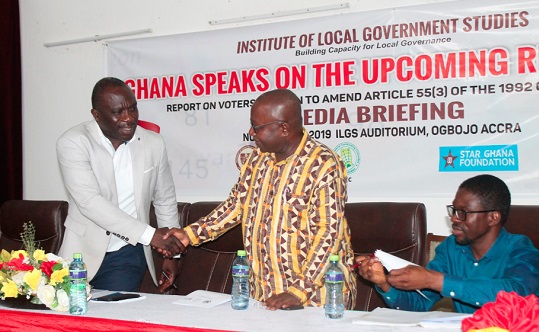 Dr Nicholas Awortwi (left), Director, Institute of Local Government Studies (ILGS), being acknowledged by Mr Frederick Agyarko Oduro, acting Dean, Studies and Research, ILGS, after briefing journalists and invited guests on the upcoming referendum.
