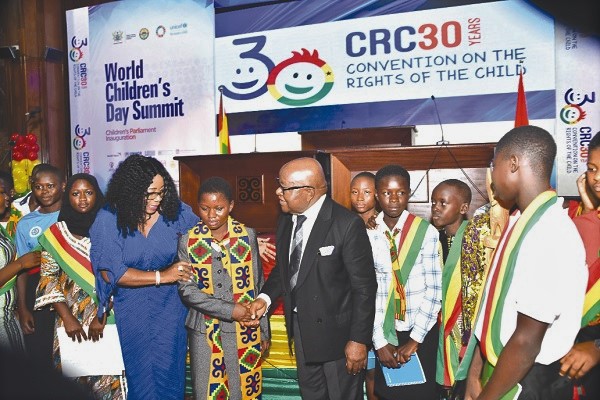  Prof. Aaron Mike Oquaye, the Speaker of Parliament, congratulating the ‘Speaker’ of the Children’s Parliament, Ms Leticia Nuritang, after the summit. With them are Mrs Cynthia Morrison, the Minister for Gender, Children and Social Protection, and some children parliamentarians. 