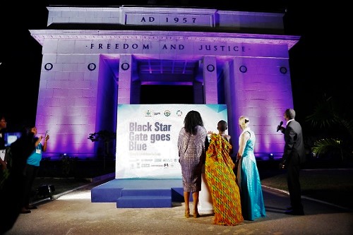 From left: Mrs Cynthia Morrison, the Minister for  Gender, Children and Social Protection; Prince Addey Clark, a pupil of St Barnabas Anglican Basic School, and Ms Marie Pierre Poirier, UNICEF’s West and Central Africa Regional Director, look on after lighting the Black Star Gate. With them is the MC for the function (right)