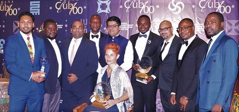 ECOM Ghana senior staff displaying the awards won