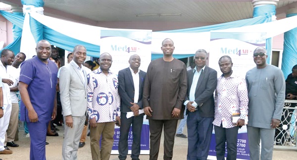 Dr Maxwell Akwasi Antwi, (2nd left), Country Director of PharmAccess Foundation (Ghana), with Mr Peter K. Yeboah (4th right), CEO of CHAG and other dignitaries at the launch.