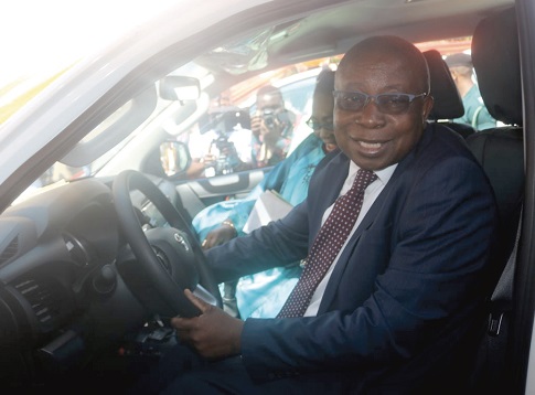   Mr Kwaku Agyemang-Manu and his deputy, Mrs Tina Mensah, taking a test drive of one of the brand new pick-up vehicles.