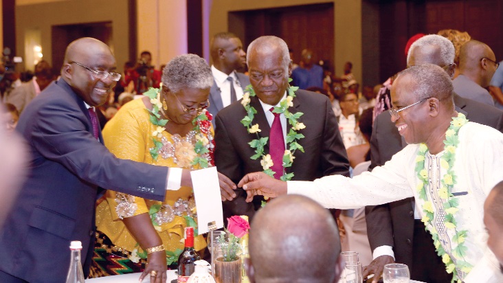 Dr Mahamudu Bawumia (left) exchanging pleasantries with Mr Yaw Boadu Ayebofo, Chairman of the National Media Commission. With them are Mrs Gifty Afenyi Dadzie and Mr KT Dadzie.   