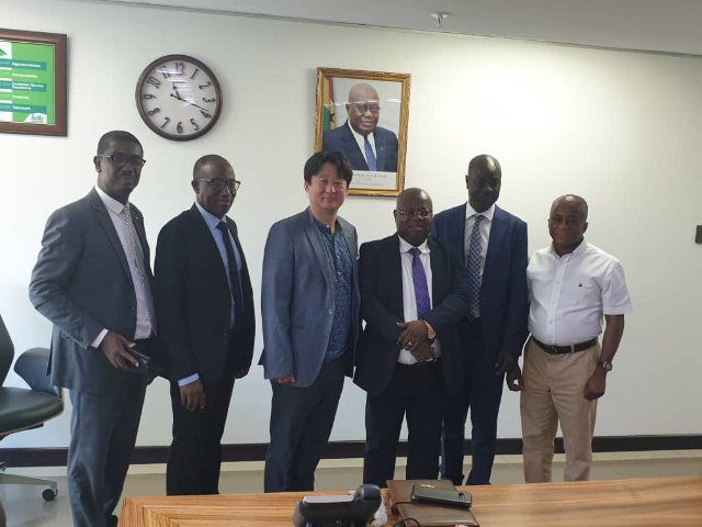 Dr John Kofi Mensah (3rd right) and Mr Wonchae Yi (3rd left). With them includes Mr Alhassan Yakubu Tali, Deputy Managing Director of ADB (2nd right) and other officials of the bank