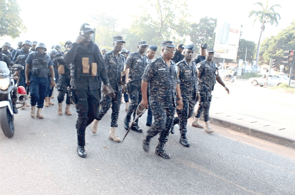 Mr James Oppong-Boanuh (3rd right) joined other police officers to march through some streets of Accra 