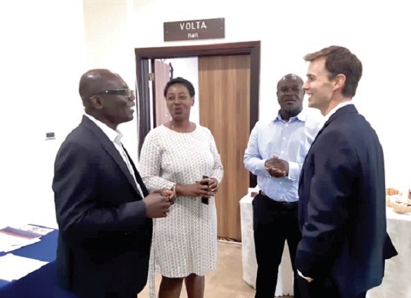  Prof. Asante (left) interacting with Dr Gerber (right), Mr Percy Adomako Agyekum, the Head of Food Evaluation and Registration, FDA, and Ms Eccles Andoh, Assistant Registrar, ISSER, during the stakeholders’ meeting.