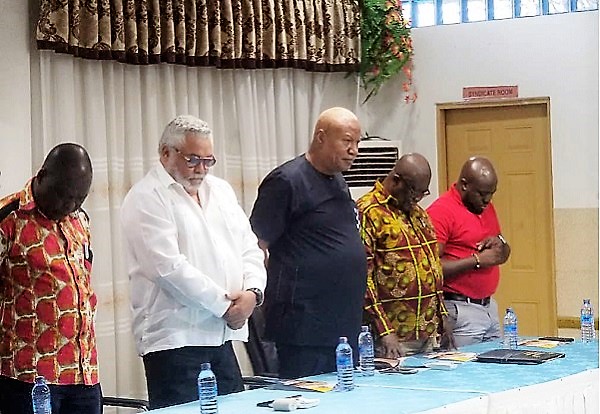 Former President Rawlings (2nd left) and other leading cadres of the NDC observing a moment of prayers