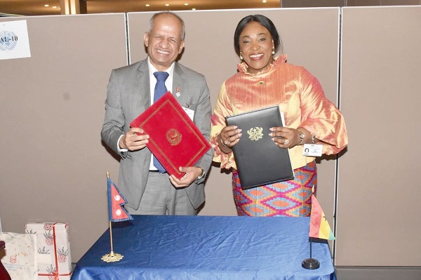  Ms Shirley Ayorkor Botchwey and her Nepalese counterpart, Pradeep Kumar Gyawali, after the signing of the agreement