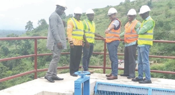 Mr John-Peter Amewu (3rd right) being conducted round the facility