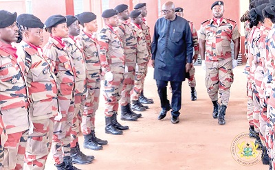 Mr Ambrose Dery inspecting a parade of Fire service personnel