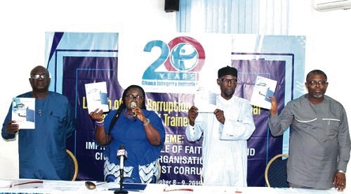 Mrs Linda Ofori -Kwafo  (2nd left), Executive Director for Ghana Integrity Initiative, with Apostle Bright B. K. Sosu (right), Vice-Chairman of the Ghana Pentecostal and Charismatic Council, Ashanti Region, Sheikh Armiyawo Shaibu (2nd right), Spokesperson for the National Chief Imam, and Mr Douglas Okonah Frempong (left), General Overseer of the Centre for Christian Outreach Ministries, launching the Anti-Corruption Training Manual. Picture: Patrick Dickson