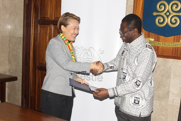 Ms Philomena Tan (left), Managing Director, Nestlé Ghana, exchanging the signed documents with Prof Samuel Kwame Offei, Pro-Vice Chancellor in charge of Academic and Student Affairs, University of Ghana (UG)